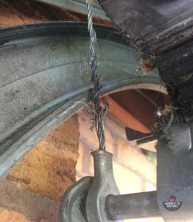 A frayed lift cable at close range. Strands part one at a time, which is why this is worth looking for before it lets go.