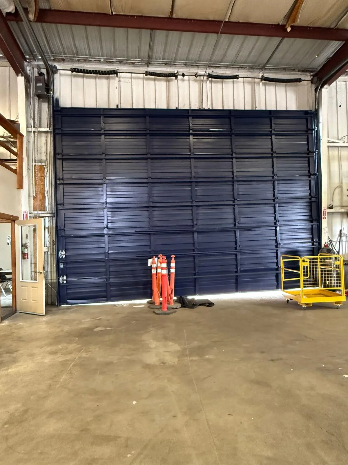 Commercial sectional door installation.