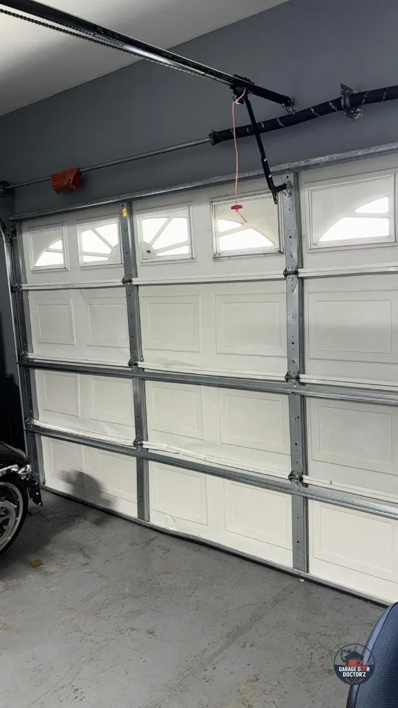 Inside view of an off-track door, showing where the roller left the channel.